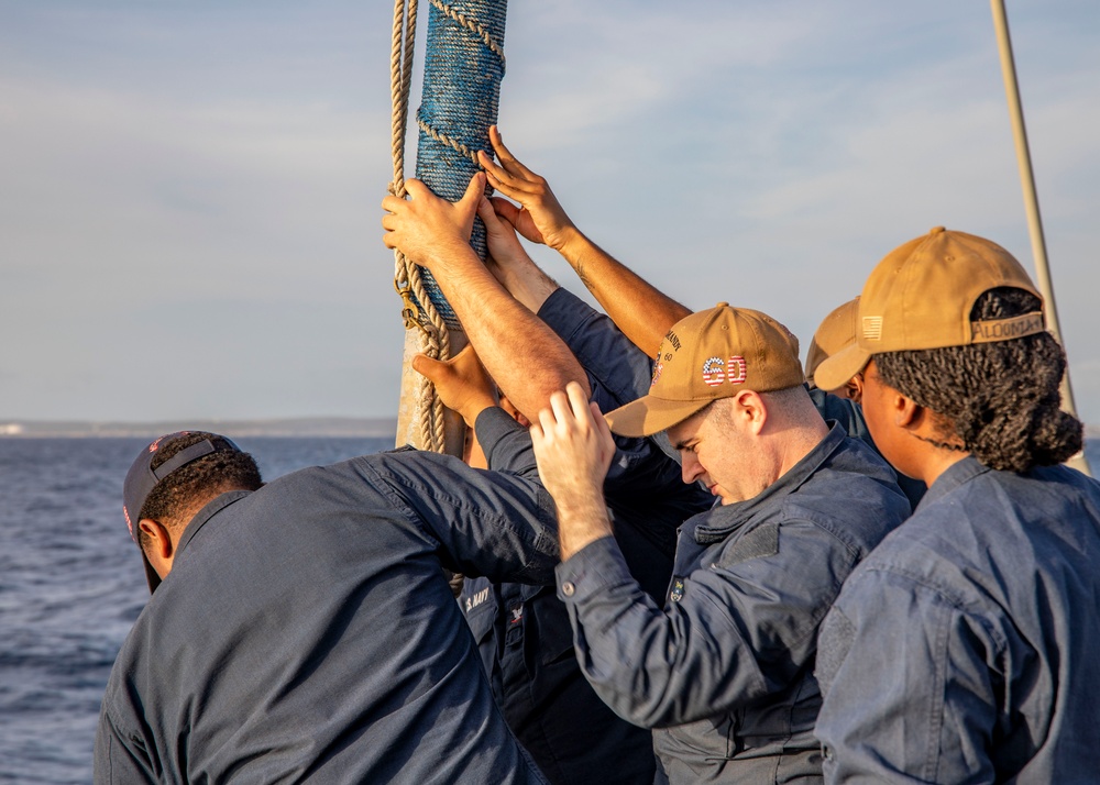 USS Normandy performs sea and anchor while pulling into Curacao