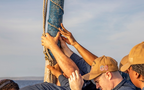 USS Normandy performs sea and anchor while pulling into Curacao