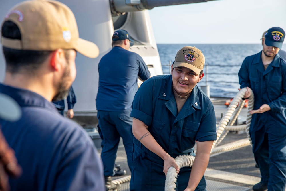 USS Normandy performs sea and anchor while pulling into Curacao