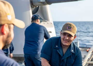 USS Normandy performs sea and anchor while pulling into Curacao