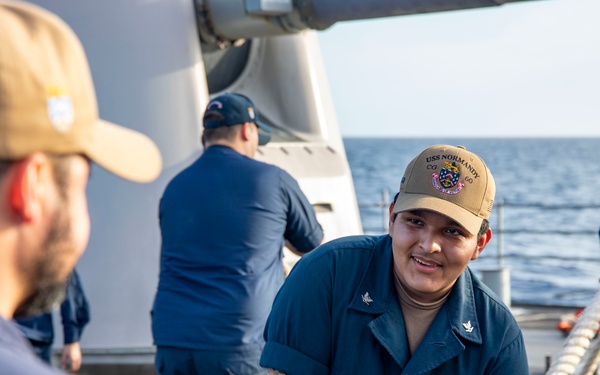 USS Normandy performs sea and anchor while pulling into Curacao