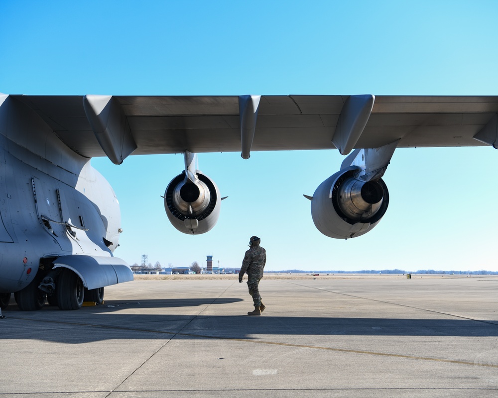 172nd Airlift Wing crew members perform pre-flight checks before departure from Springfield-Beckley Municipal Airport