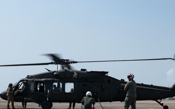 U.S. Marines perform aviation-delivered ground refueling on U.S. Army Sikorsky UH-60 Black Hawk during Cobra Gold 25