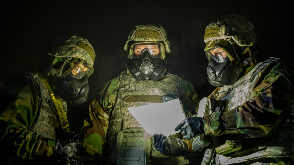 Yokota Airmen perform decontamination of aircraft, aircrew during BM 25-2