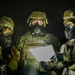 Yokota Airmen perform decontamination of aircraft, aircrew during BM 25-2