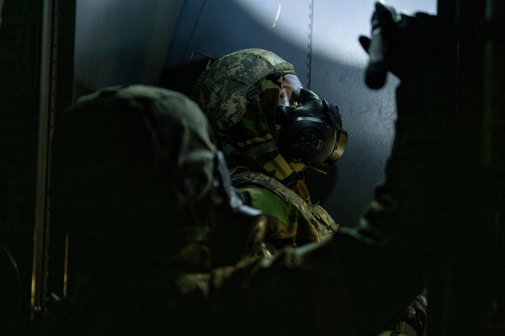 Yokota Airmen perform decontamination of aircraft, aircrew during BM 25-2