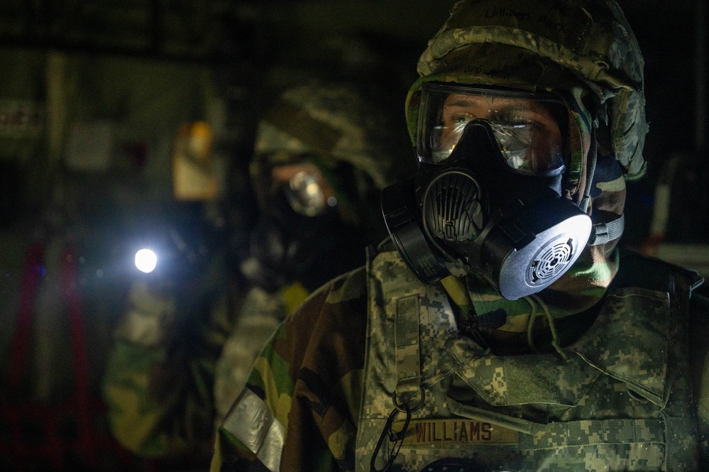 Yokota Airmen perform decontamination of aircraft, aircrew during BM 25-2