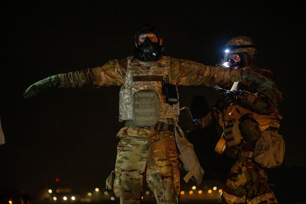Yokota Airmen perform decontamination of aircraft, aircrew during BM 25-2