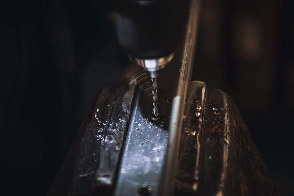 USS Ronald Reagan (CVN 76) Sailor cuts Angle Irons