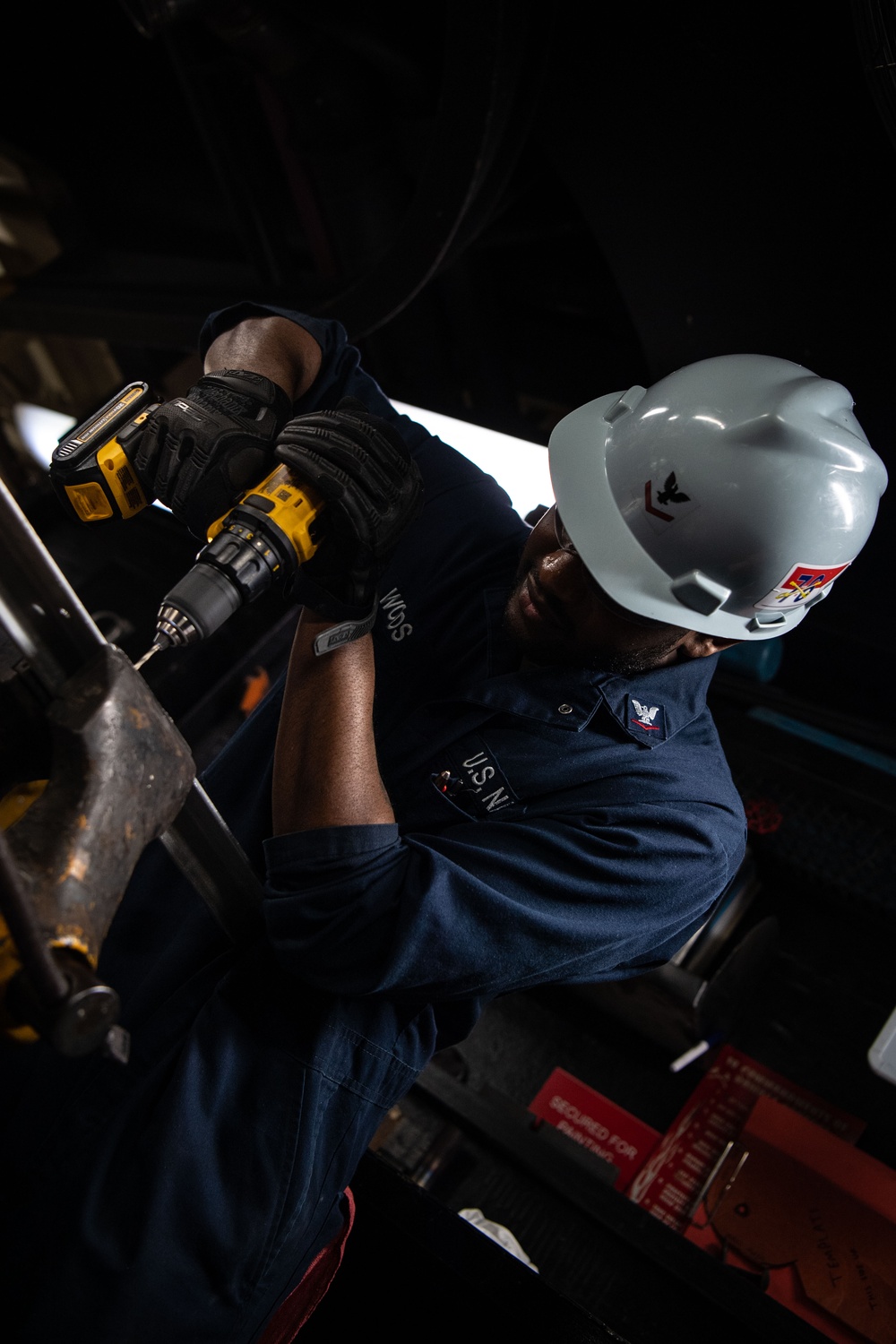 USS Ronald Reagan (CVN 76) Sailor cuts Angle Irons