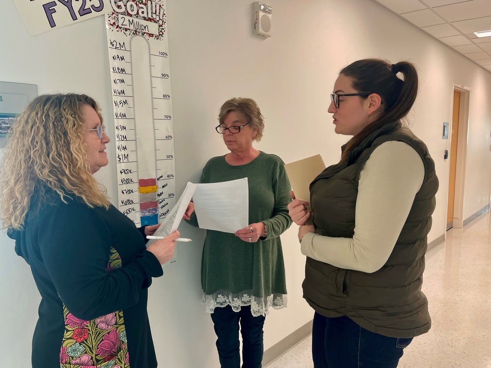 Members of the Uniform Business Office at Bassett Army Community hospital review income related to other health insurance.