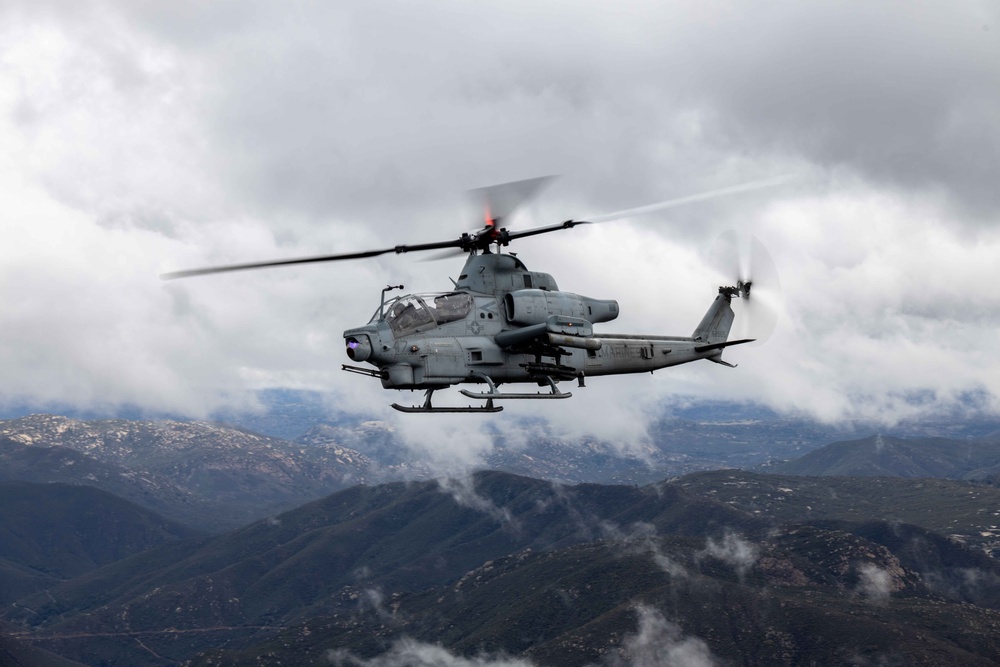 U.S. Marines with HMLA-367 fly over Miramar National Cemetery to honor veteran
