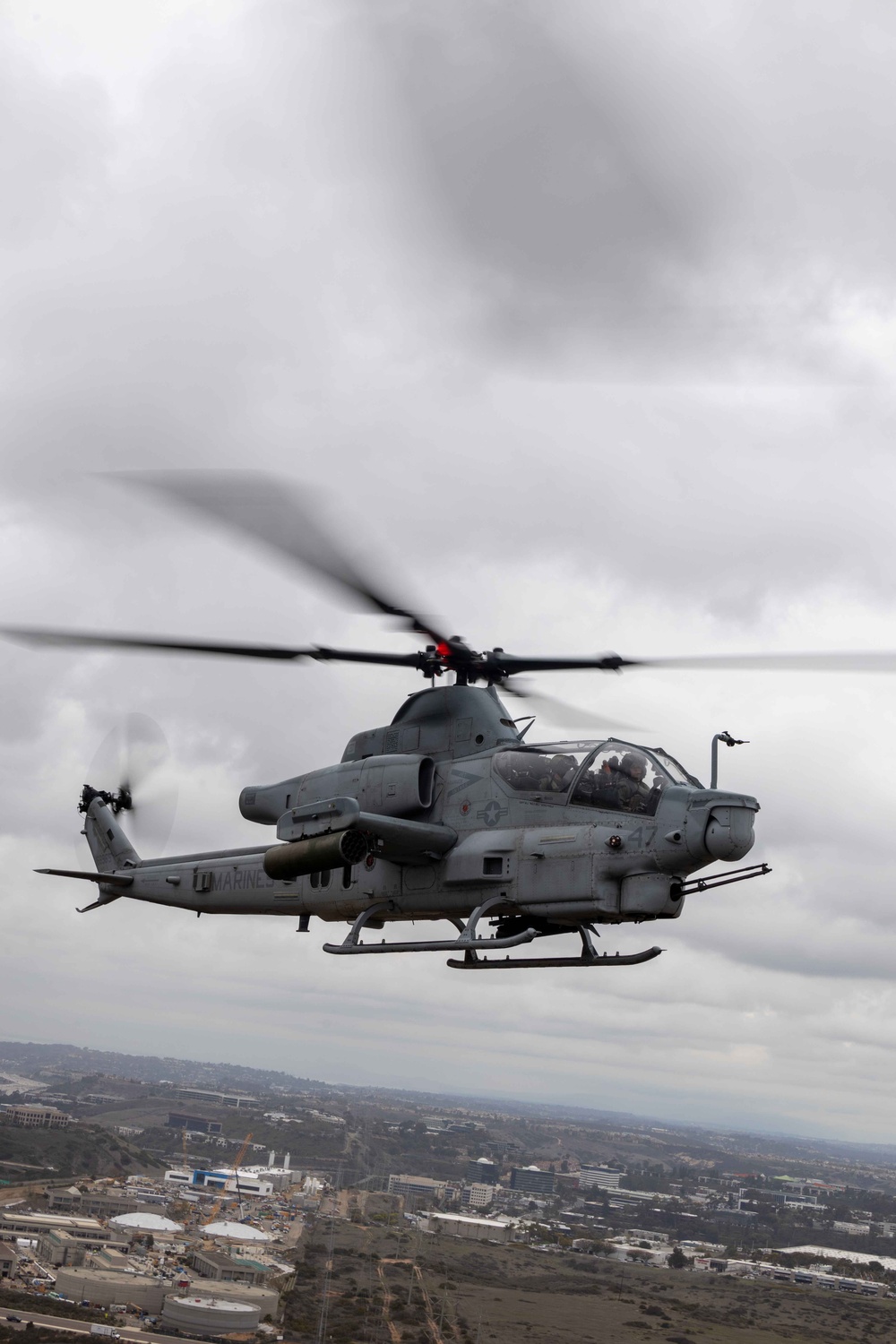 U.S. Marines with HMLA-367 fly over Miramar National Cemetery to honor veteran