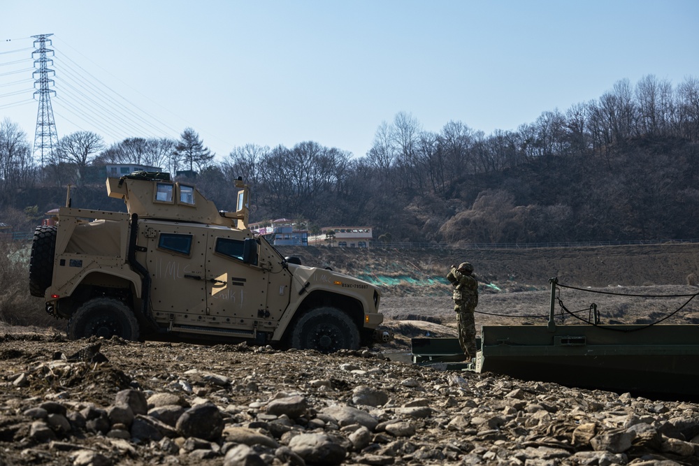 Stronger Together, U.S. Marines and U.S. Army Soldiers Move Equipment Using an Improved Ribbon Bridge