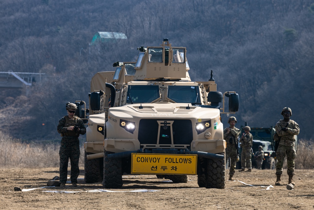 Stronger Together, U.S. Marines and U.S. Army Soldiers Move Equipment Using an Improved Ribbon Bridge