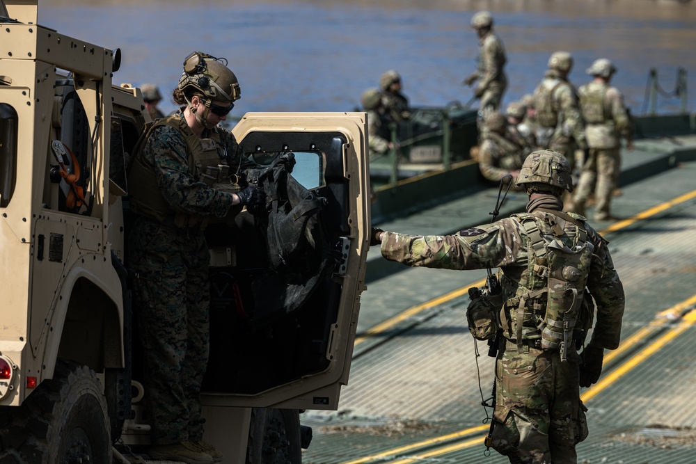 Stronger Together, U.S. Marines and U.S. Army Soldiers Move Equipment Using an Improved Ribbon Bridge