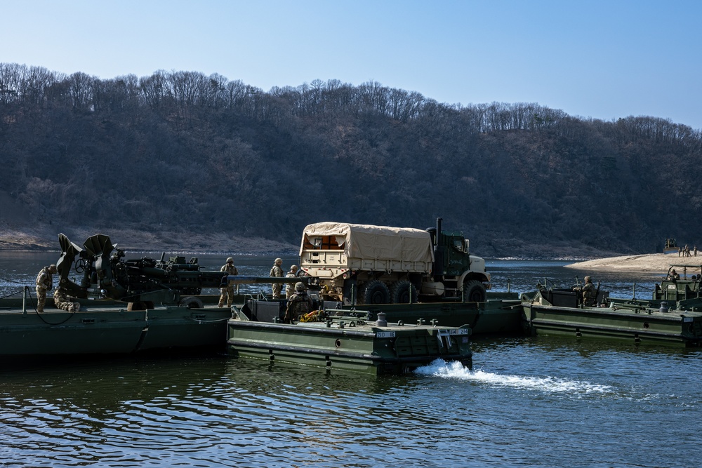 Stronger Together, U.S. Marines and U.S. Army Soldiers Move Equipment Using an Improved Ribbon Bridge