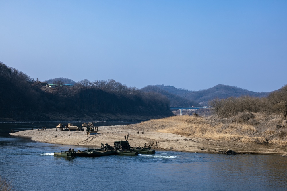 Stronger Together, U.S. Marines and U.S. Army Soldiers Move Equipment Using an Improved Ribbon Bridge