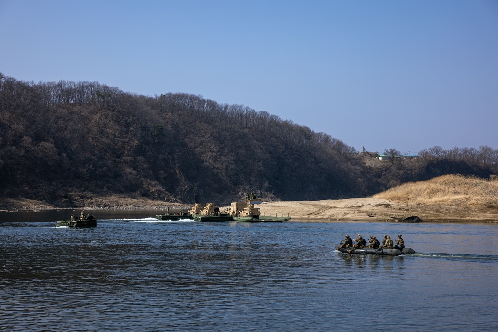 Stronger Together, U.S. Marines and U.S. Army Soldiers Move Equipment Using an Improved Ribbon Bridge