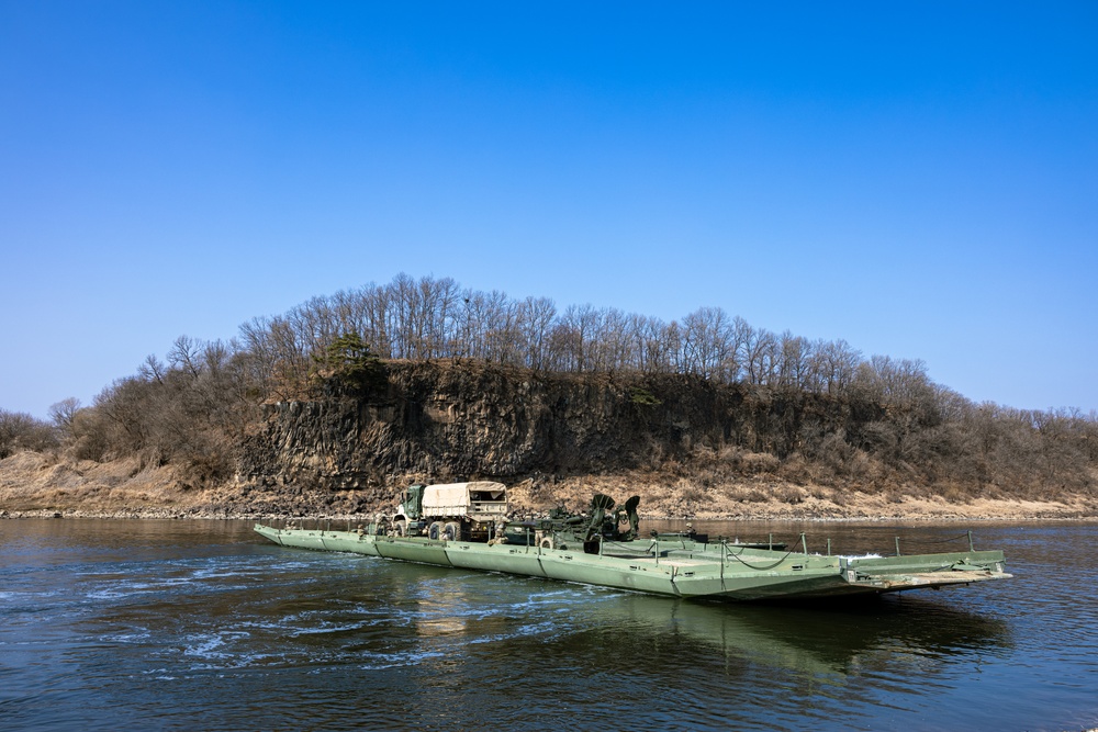 Stronger Together, U.S. Marines and U.S. Army Soldiers Move Equipment Using an Improved Ribbon Bridge