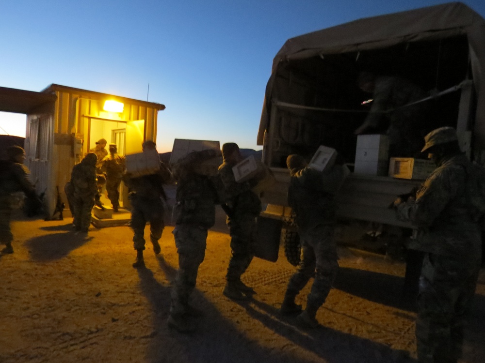 HHC 650th RSG loads ammo into LMTV