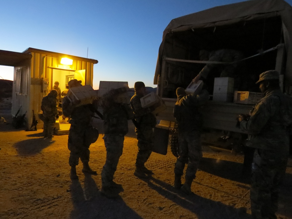 HHC 650th RSG loads ammo into LMTV