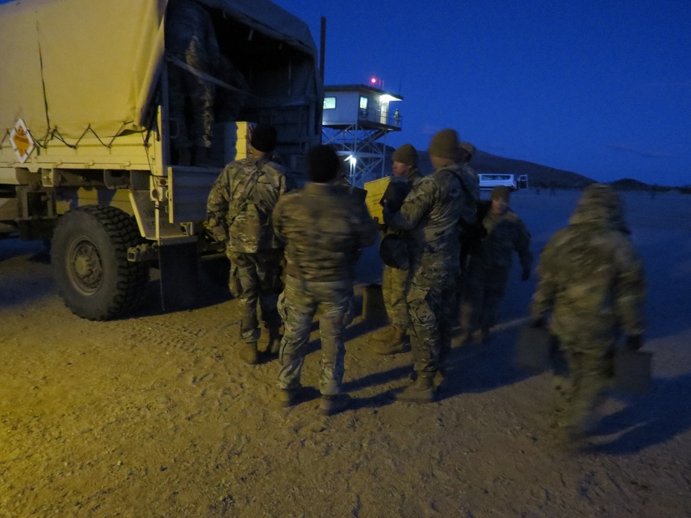 HHC 650th RSG loads ammo into LMTV