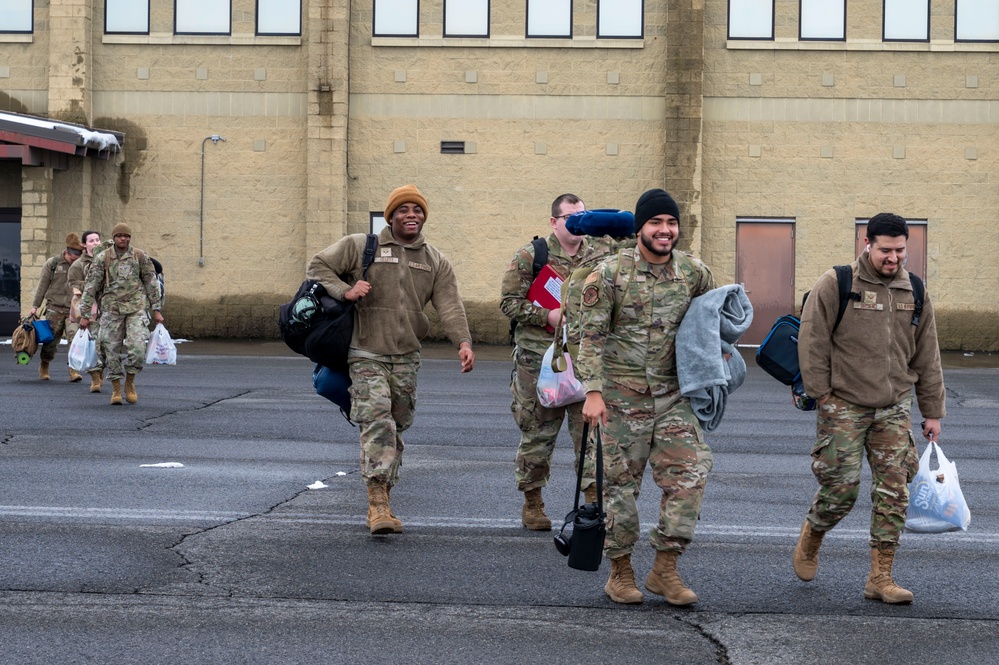 U.S. Airmen assigned to the 92nd Air Refueling Wing depart for a deployment
