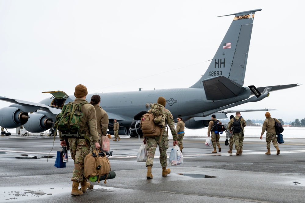 U.S. Airmen assigned to the 92nd Air Refueling Wing depart for a deployment