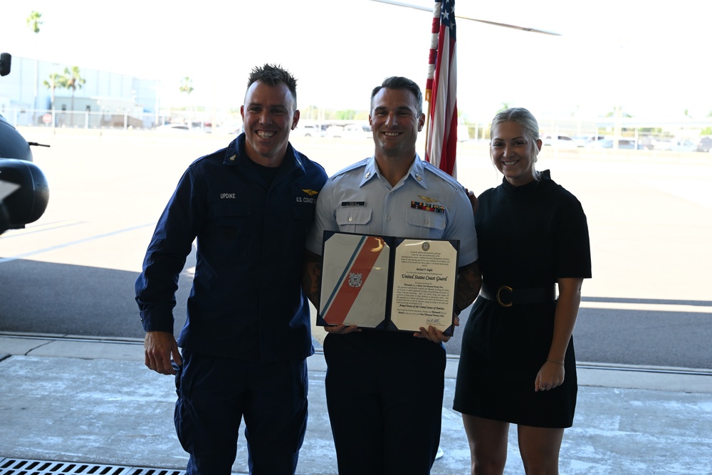 Seventh Coast Guard District commander meritoriously advances member