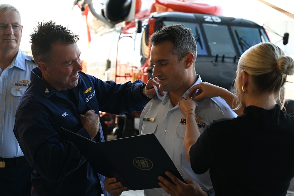 Seventh Coast Guard District commander meritoriously advances member