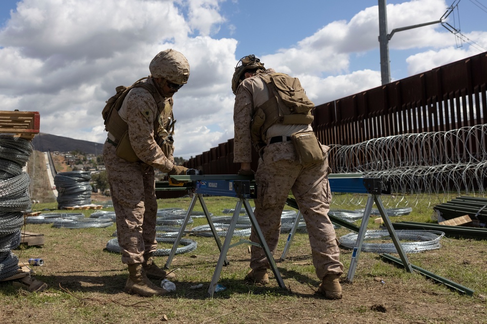 U.S. Marines mount concertina wire along southern border barrier