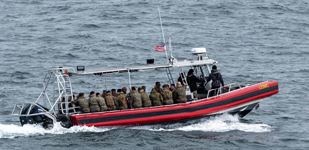 U.S. Marines disembark from the USS Somerset (LPD 25) during QUART 25.2