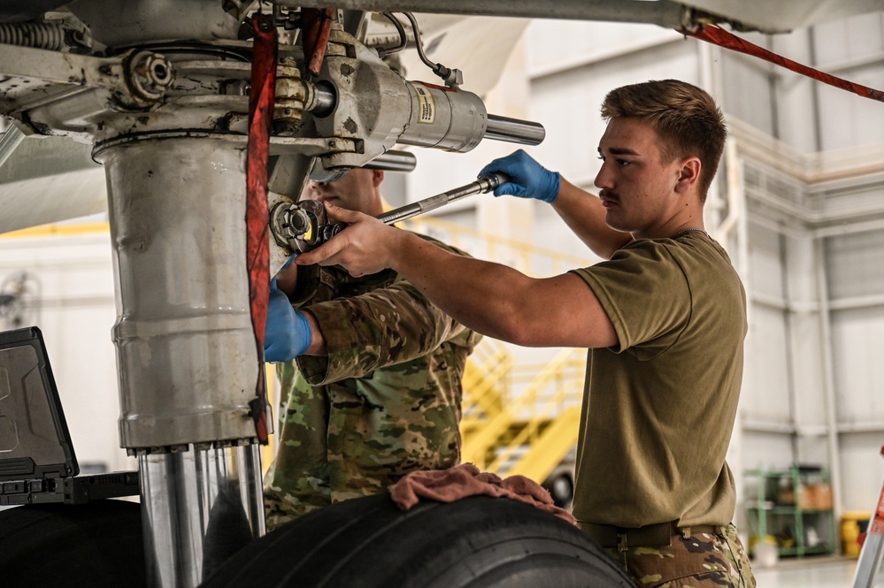 445th AMXS Airman uses torque wrench on C-17 Globemaster III