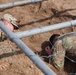 Soldier conquers low crawl obstacle