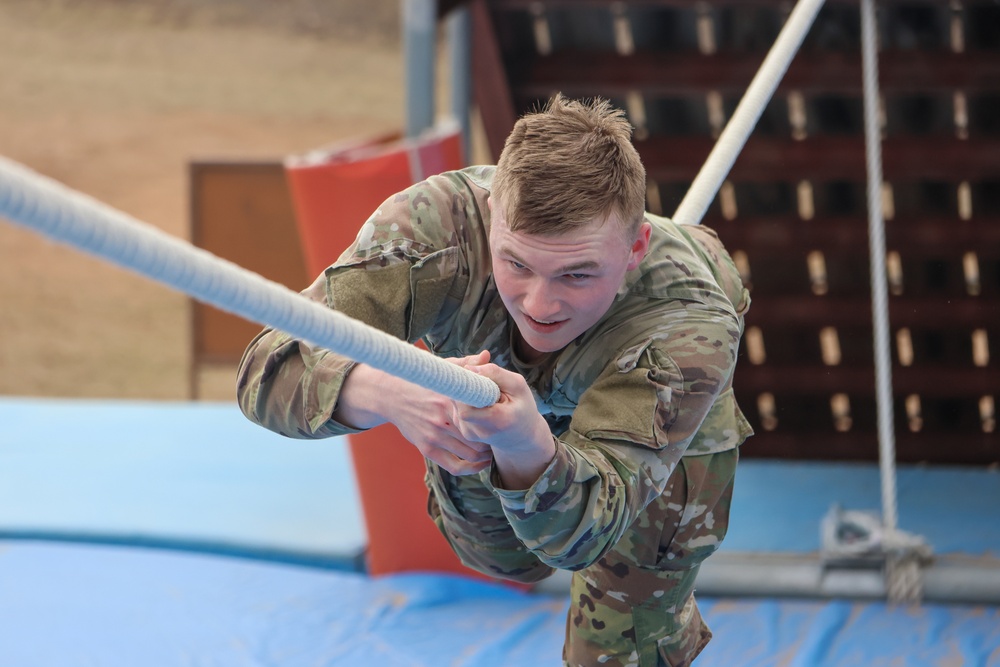 First competitor takes on rope obstacle