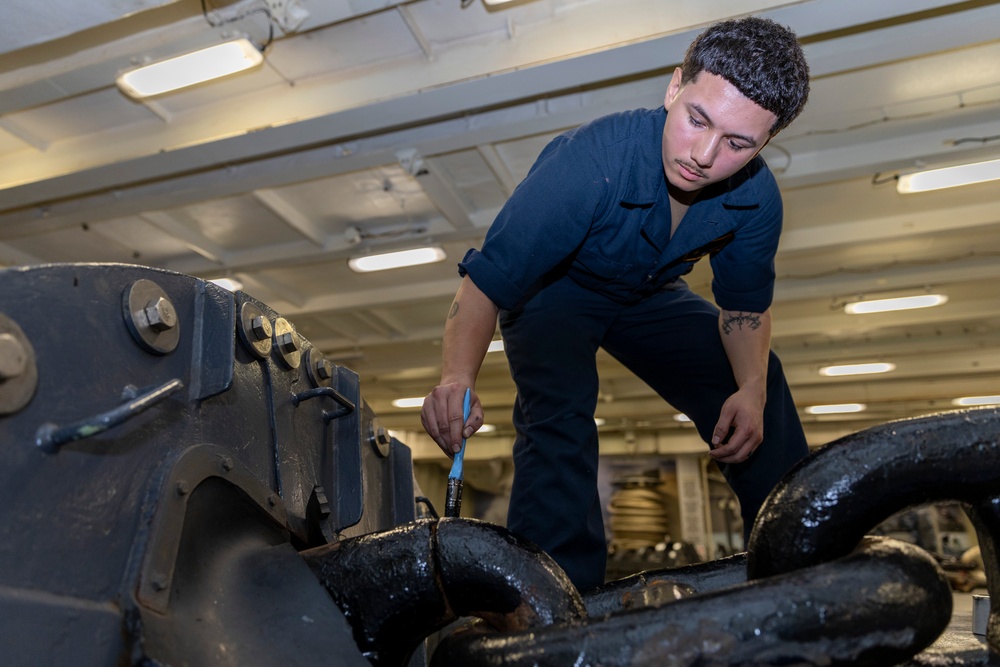 Boatswain’s Mate Paints Anchor Chains