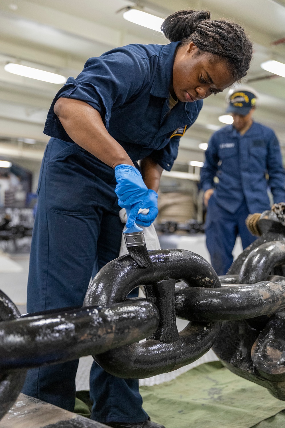 Boatswain’s Mate Paints Anchor Chains