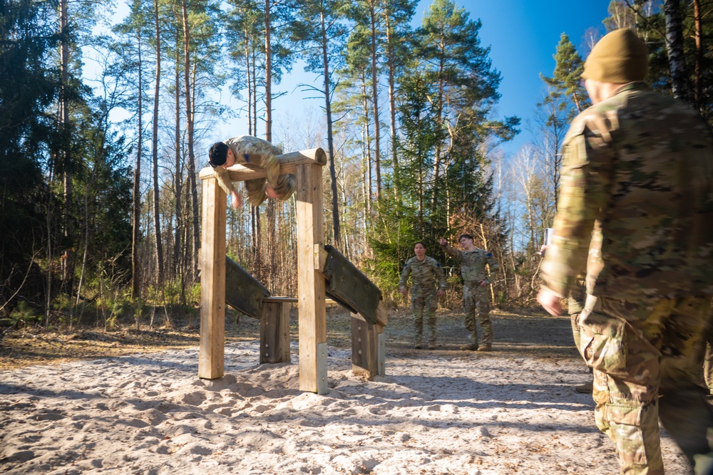 U.S. Soldiers efficiently pass obstacles of a confidence course during MRC competition
