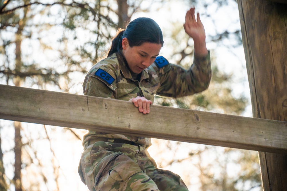U.S. Soldiers efficiently pass obstacles of a confidence course during MRC competition