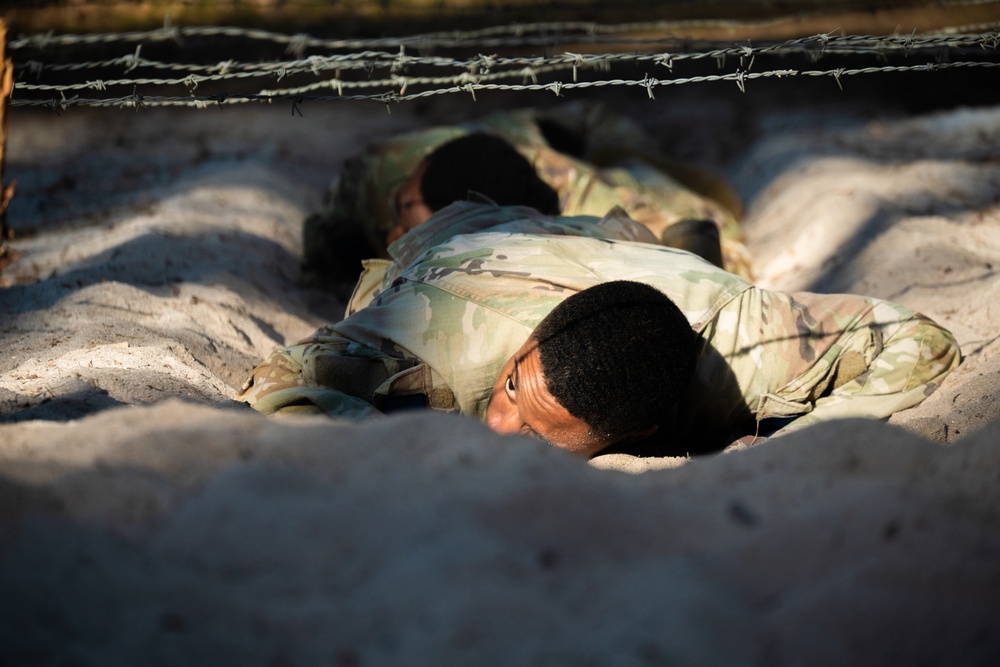 U.S. Soldiers efficiently pass obstacles of a confidence course during MRC competition