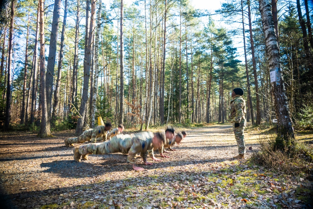 U.S. Soldiers efficiently pass obstacles of a confidence course during MRC competition