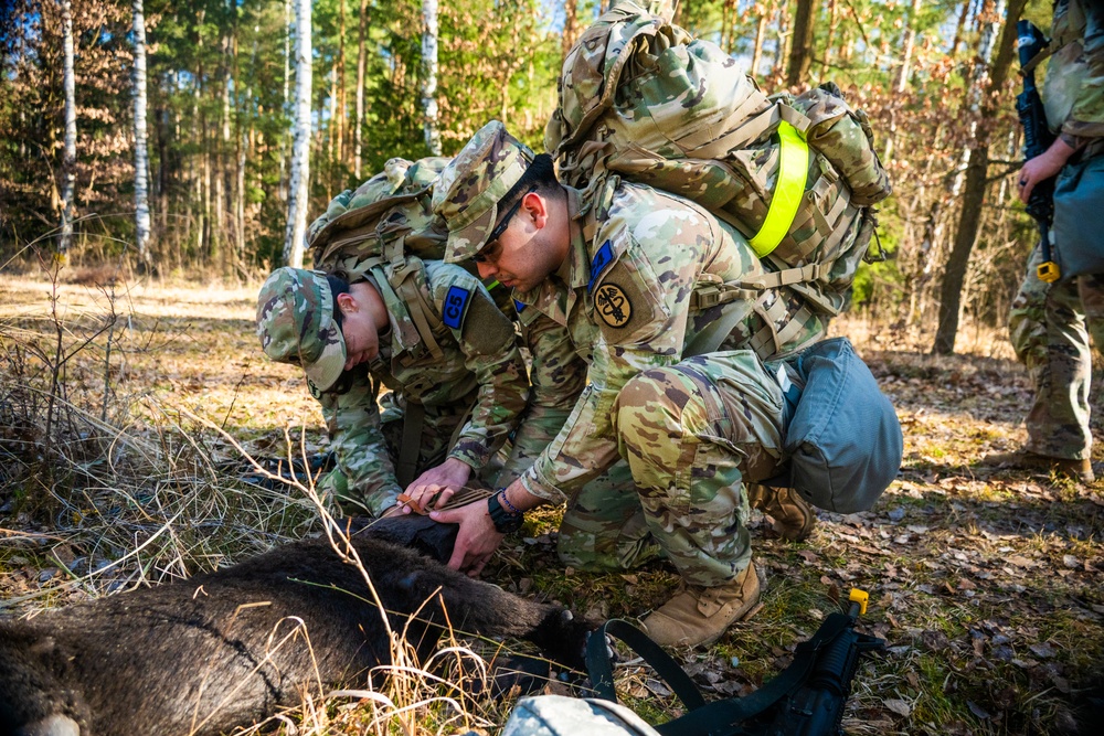 U.S. Soldiers pack wound of robot dog during MRC competition