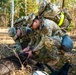 U.S. Soldiers pack wound of robot dog during MRC competition