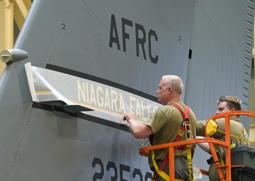 914th ARW craftsmen install new fin flash on KC-135 Stratotanker