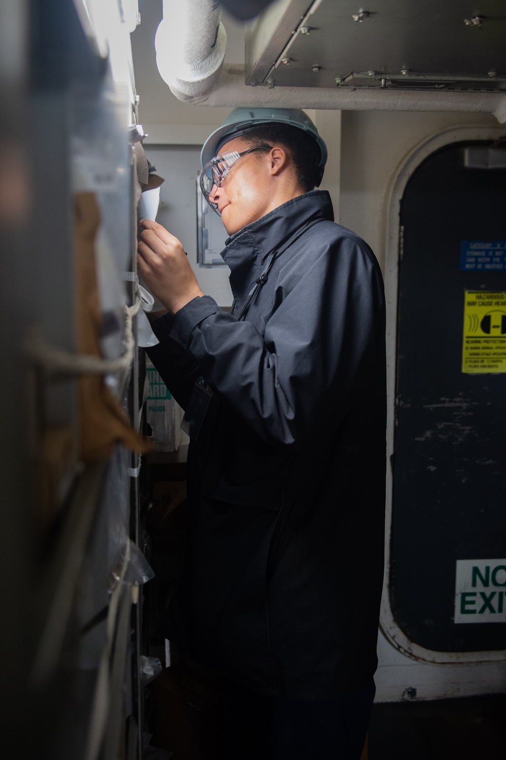 USS Ronald Reagan (CVN 76) Sailors conduct inventory