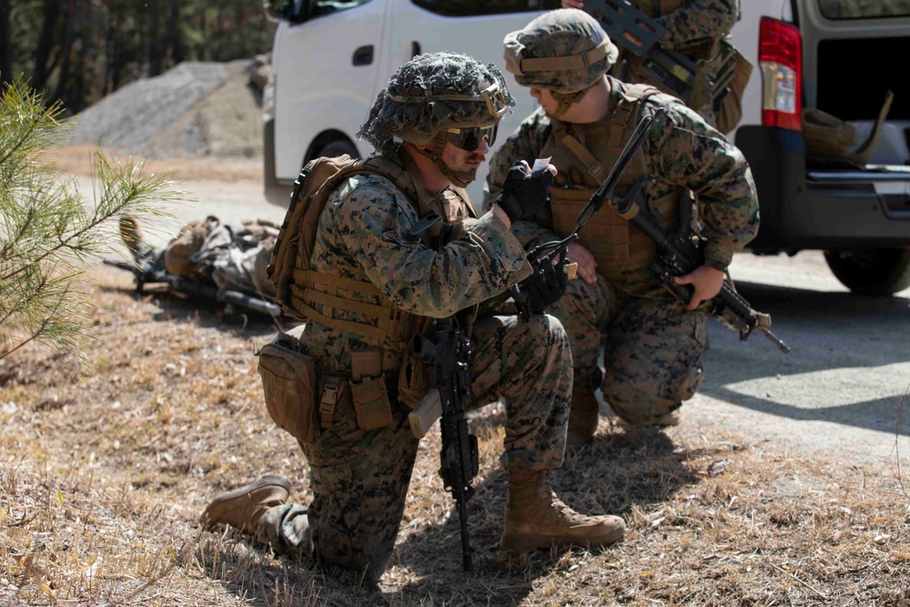 Japan-based Marines practice patrolling and vehicle maintenance