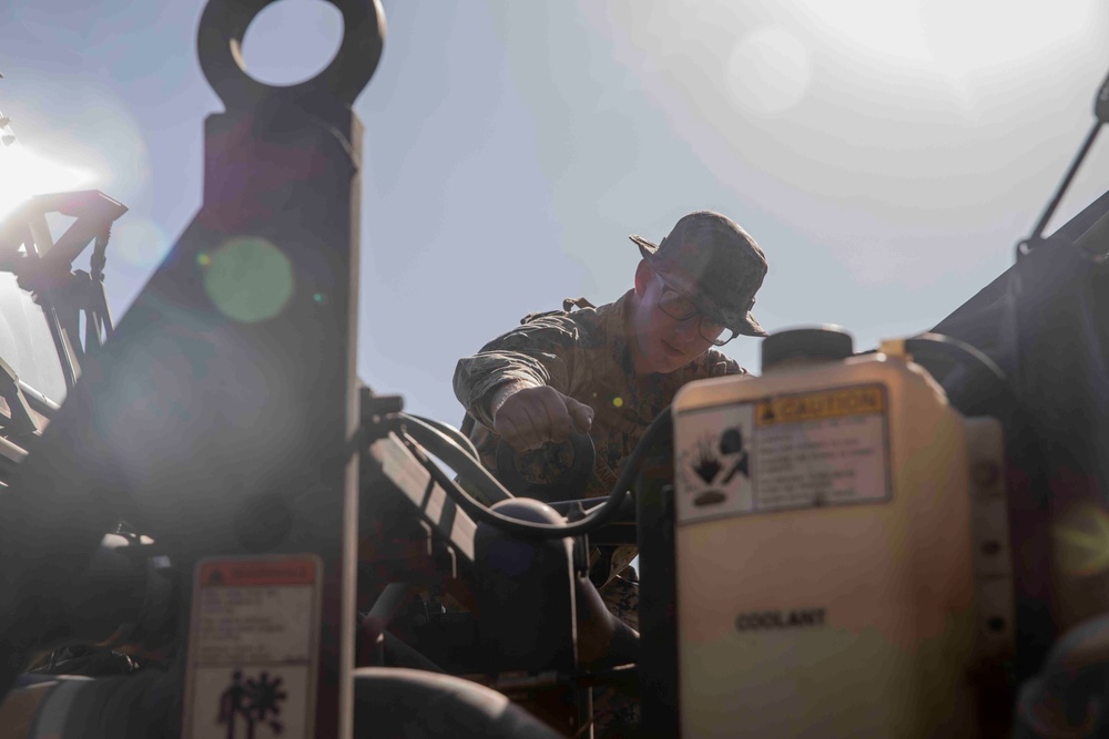 Japan-based Marines practice patrolling and vehicle maintenance
