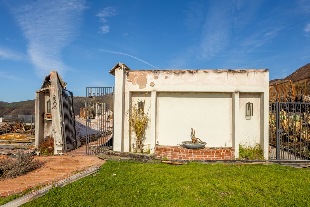 Fire-Damaged Home Awaits Debris Removal