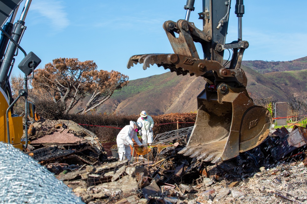 Debris Removal Continues at Fire-Damaged Home